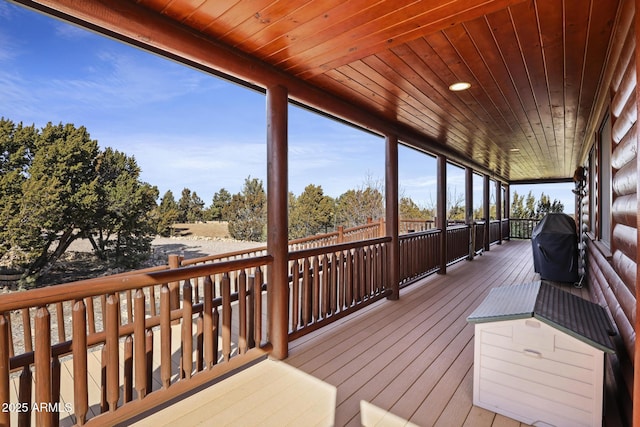 wooden terrace featuring area for grilling