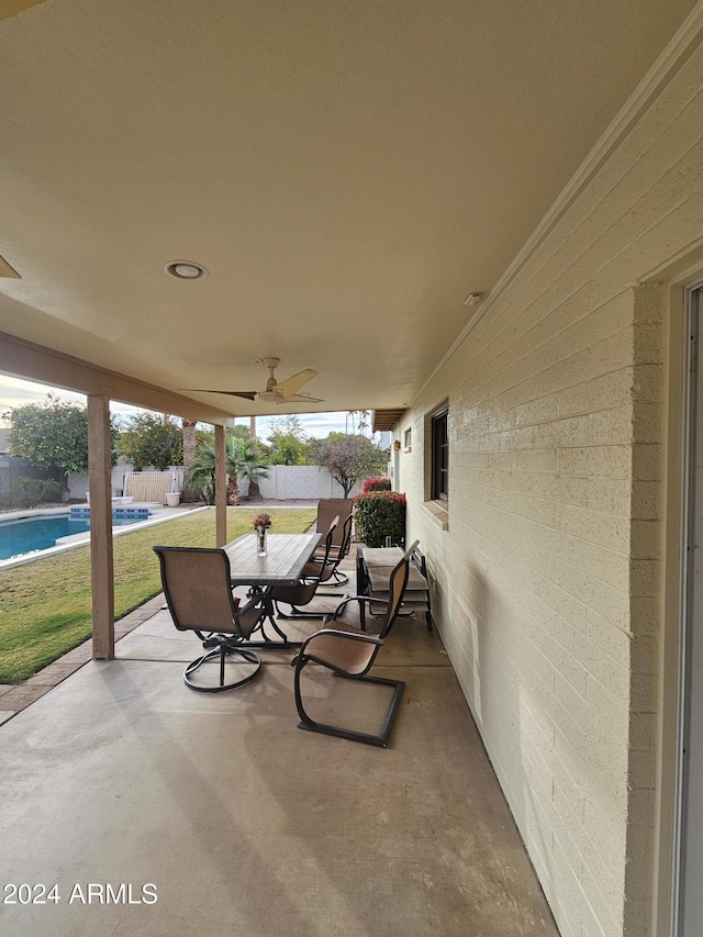 view of patio featuring ceiling fan