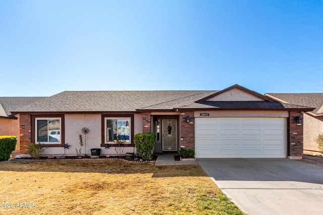 single story home with a front yard and a garage