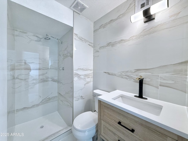 bathroom with a marble finish shower, visible vents, toilet, and vanity