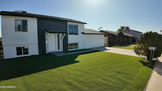 view of front of home featuring a garage, stucco siding, concrete driveway, and a front yard