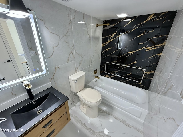 full bathroom with stone wall, toilet, marble finish floor, and shower / bath combination