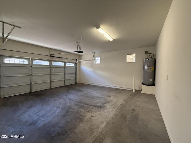 garage featuring a garage door opener and electric water heater