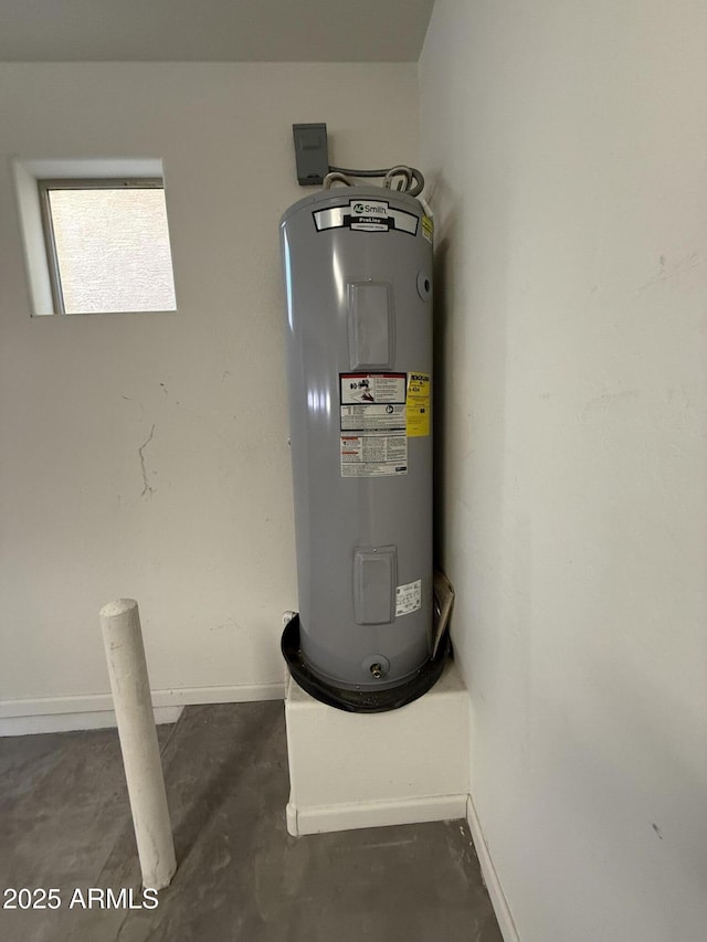 utility room featuring water heater