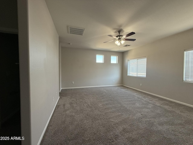 carpeted empty room featuring ceiling fan