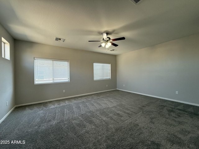 carpeted empty room with a textured ceiling and ceiling fan