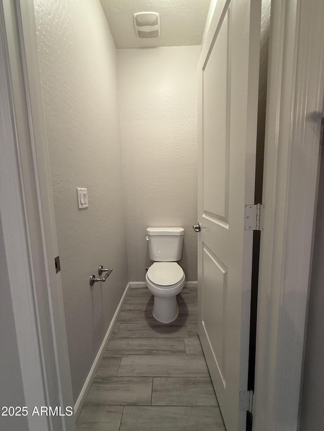 bathroom featuring toilet