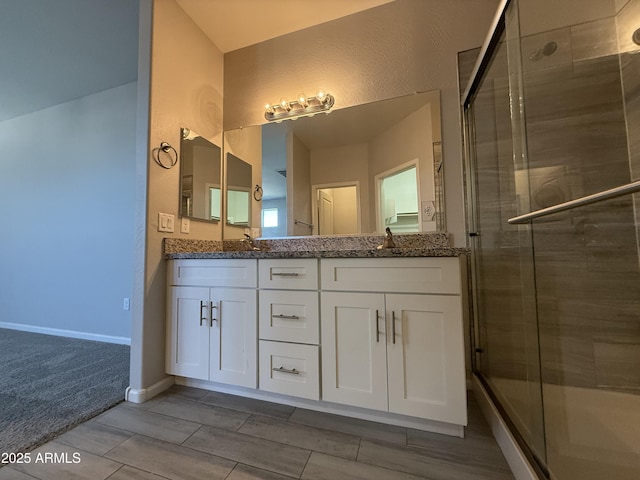 bathroom with vanity and walk in shower