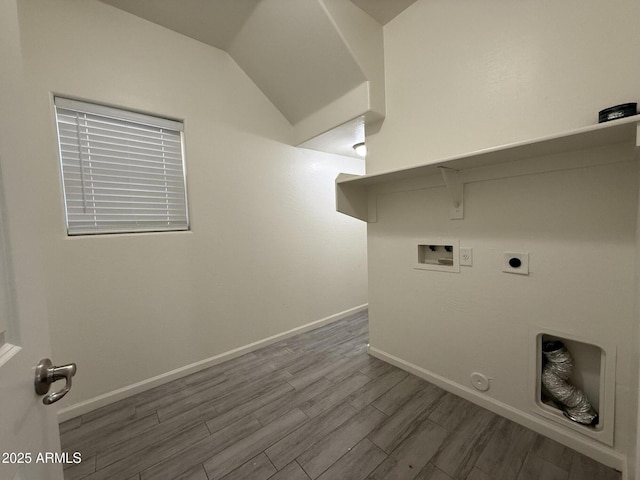 laundry area featuring washer hookup, hookup for a gas dryer, electric dryer hookup, and hardwood / wood-style flooring