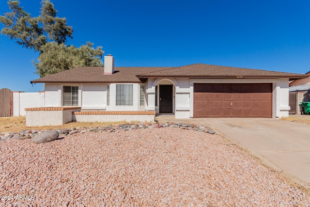 ranch-style home with a garage