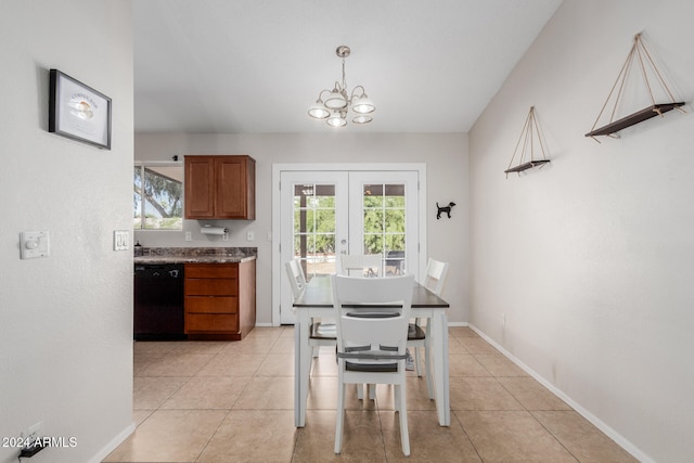 tiled dining area featuring french doors, a healthy amount of sunlight, and a chandelier