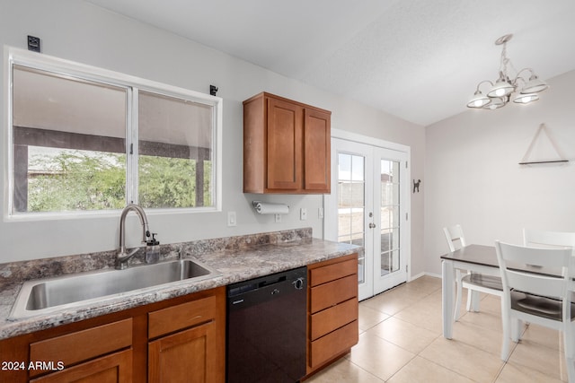 kitchen featuring sink, black dishwasher, vaulted ceiling, and a wealth of natural light