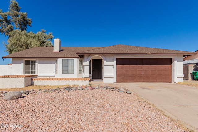 single story home with a garage