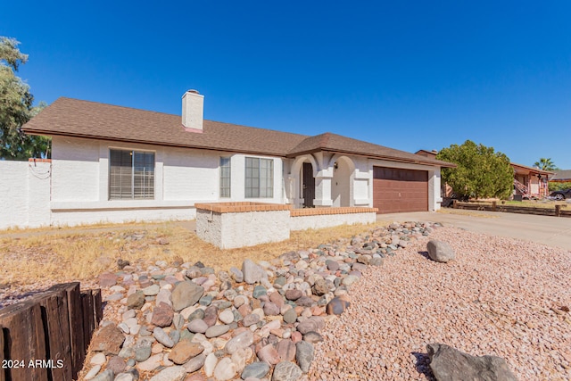 ranch-style house with a garage