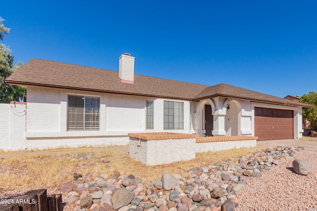 ranch-style house with a garage