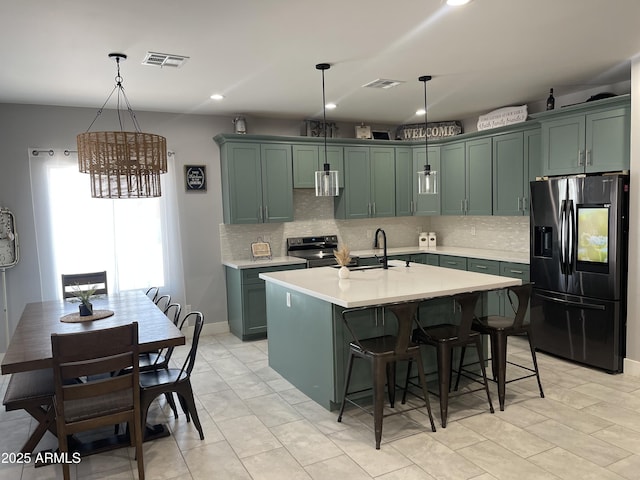 1724 N Main Dr, Apache Junction, AZ 85120 - kitchen with refrigerator with ice dispenser, light countertops, a chandelier, decorative backsplash, and recessed lighting