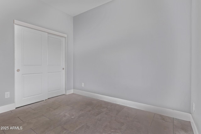 1724 N Main Dr, Apache Junction, AZ 85120 - unfurnished bedroom featuring baseboards and a closet