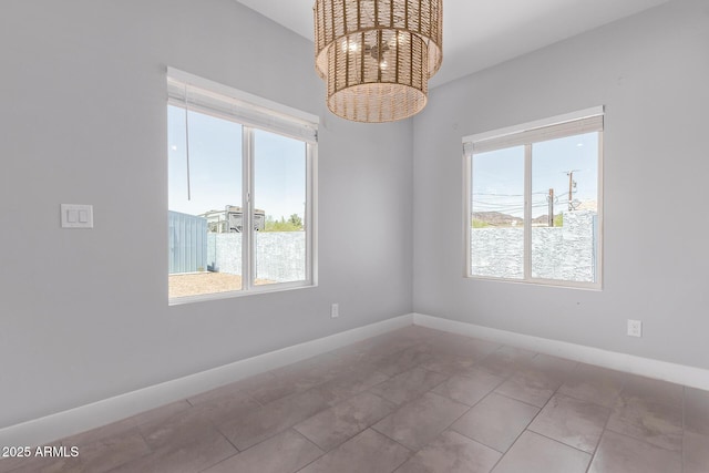 1724 N Main Dr, Apache Junction, AZ 85120 - unfurnished room with baseboards and a chandelier