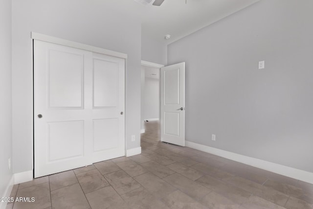 1724 N Main Dr, Apache Junction, AZ 85120 - unfurnished bedroom featuring a closet, baseboards, and ceiling fan