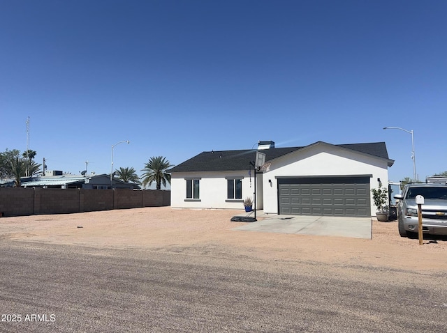 1724 N Main Dr, Apache Junction, AZ 85120 - ranch-style house with a garage, stucco siding, and concrete driveway