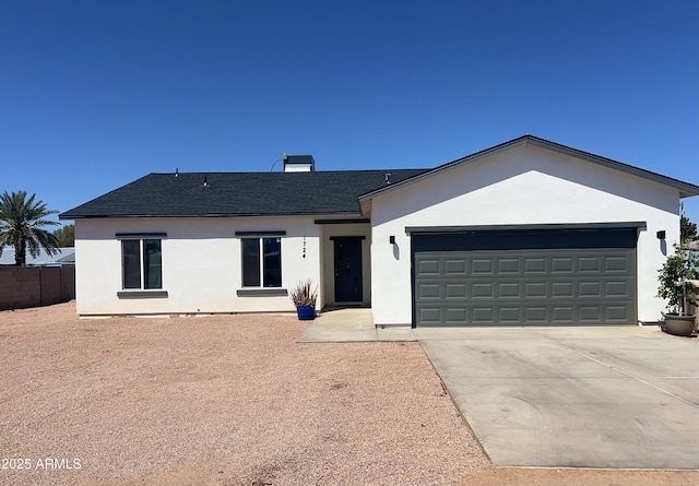 1724 N Main Dr, Apache Junction, AZ 85120 - ranch-style home with stucco siding, an attached garage, and roof with shingles