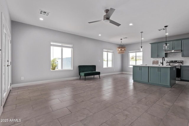 1724 N Main Dr, Apache Junction, AZ 85120 - kitchen featuring electric range, light countertops, recessed lighting, open floor plan, and ceiling fan