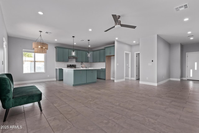 1724 N Main Dr, Apache Junction, AZ 85120 - kitchen with open floor plan, recessed lighting, light countertops, decorative backsplash, and baseboards