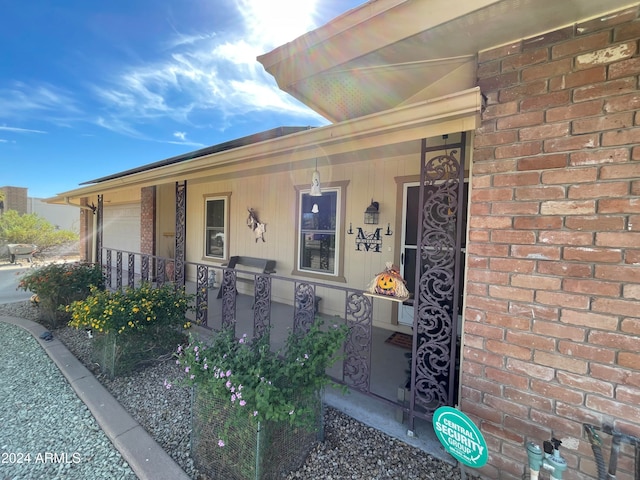 doorway to property featuring covered porch