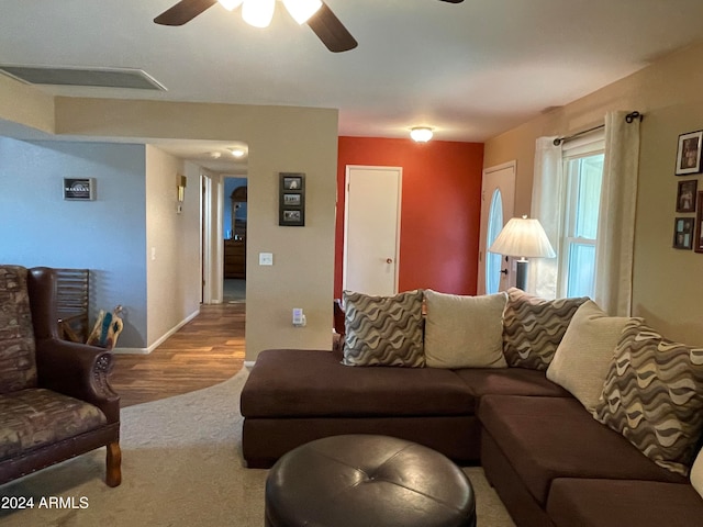 living room with hardwood / wood-style floors and ceiling fan