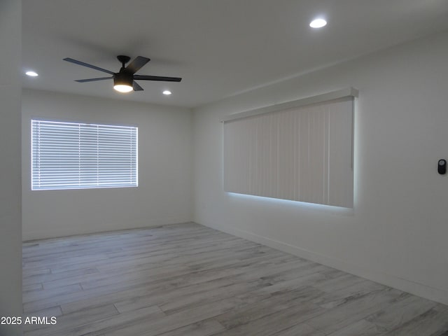 empty room featuring ceiling fan, wood finished floors, and recessed lighting