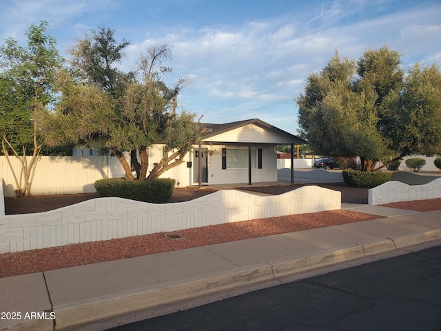 view of front facade featuring fence