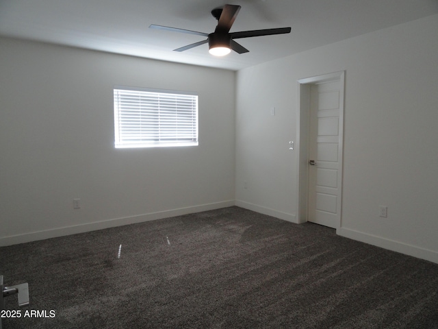 spare room with ceiling fan, carpet floors, and baseboards