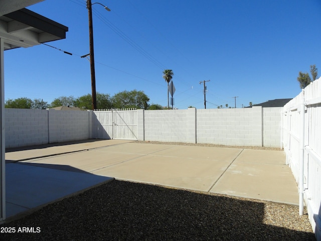 view of patio / terrace with a fenced backyard and a gate