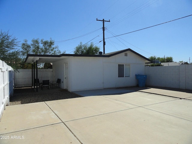 back of property with a patio area and a fenced backyard