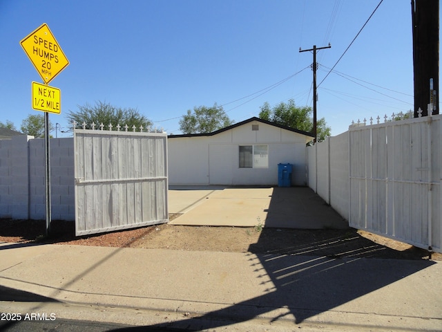 view of parking / parking lot with fence