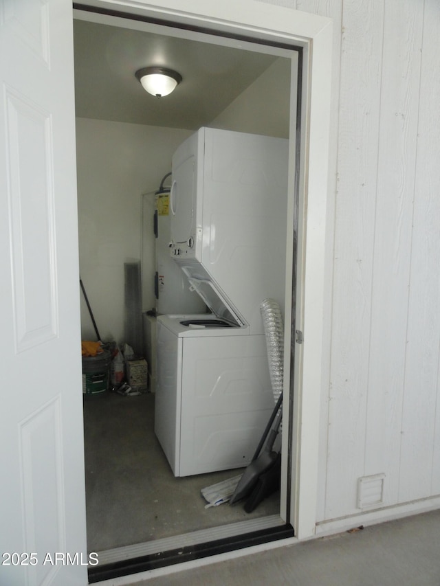 washroom with stacked washer and clothes dryer