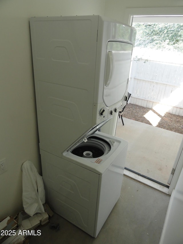 laundry room featuring estacked washer and dryer