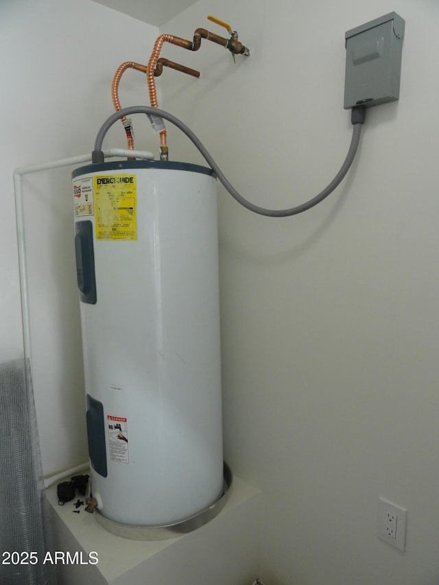 utility room featuring electric water heater