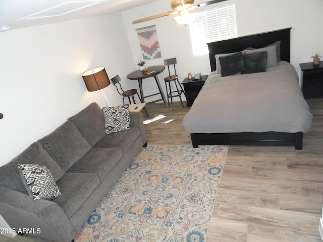 bedroom with wood finished floors