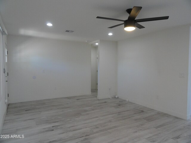 spare room featuring a ceiling fan, recessed lighting, and light wood-style floors
