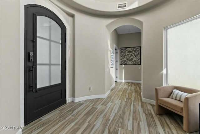 foyer entrance with light hardwood / wood-style floors