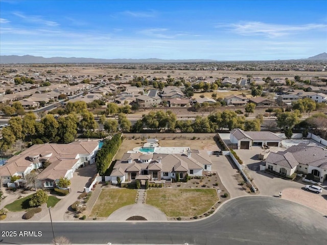 birds eye view of property featuring a mountain view