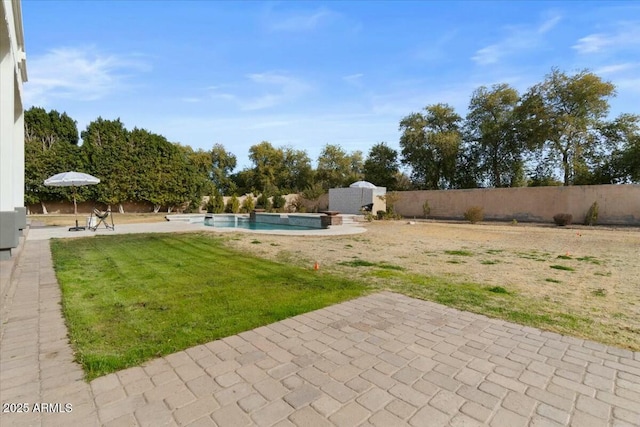 view of yard with a fenced in pool and a storage shed