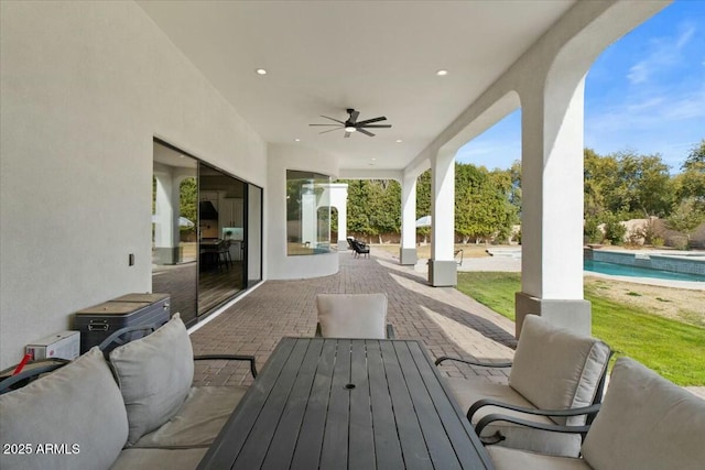 view of patio / terrace featuring ceiling fan