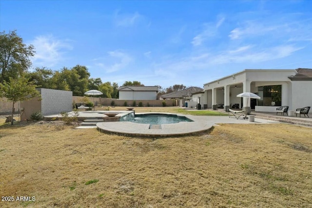 view of swimming pool featuring a patio area and a yard