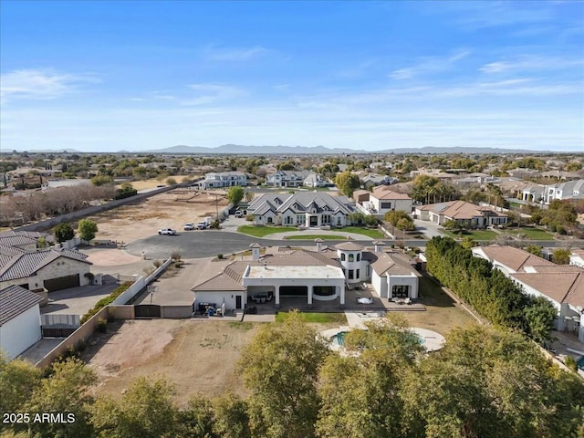 birds eye view of property featuring a mountain view