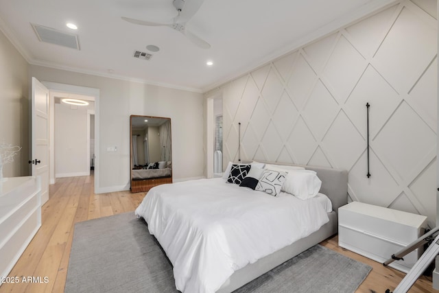 bedroom with hardwood / wood-style flooring, ceiling fan, and ornamental molding