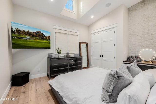 bedroom featuring a closet and light hardwood / wood-style flooring