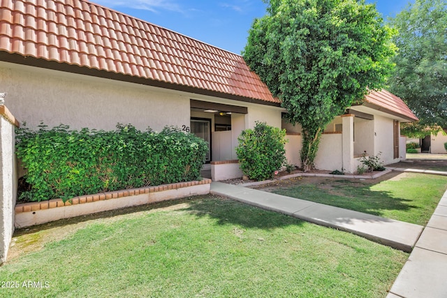 195 N Cottonwood St Unit 26, Chandler, AZ 85225 - view of front of home featuring a tile roof, stucco siding, and a front yard