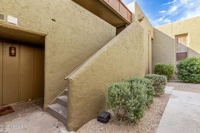 view of property exterior with stucco siding